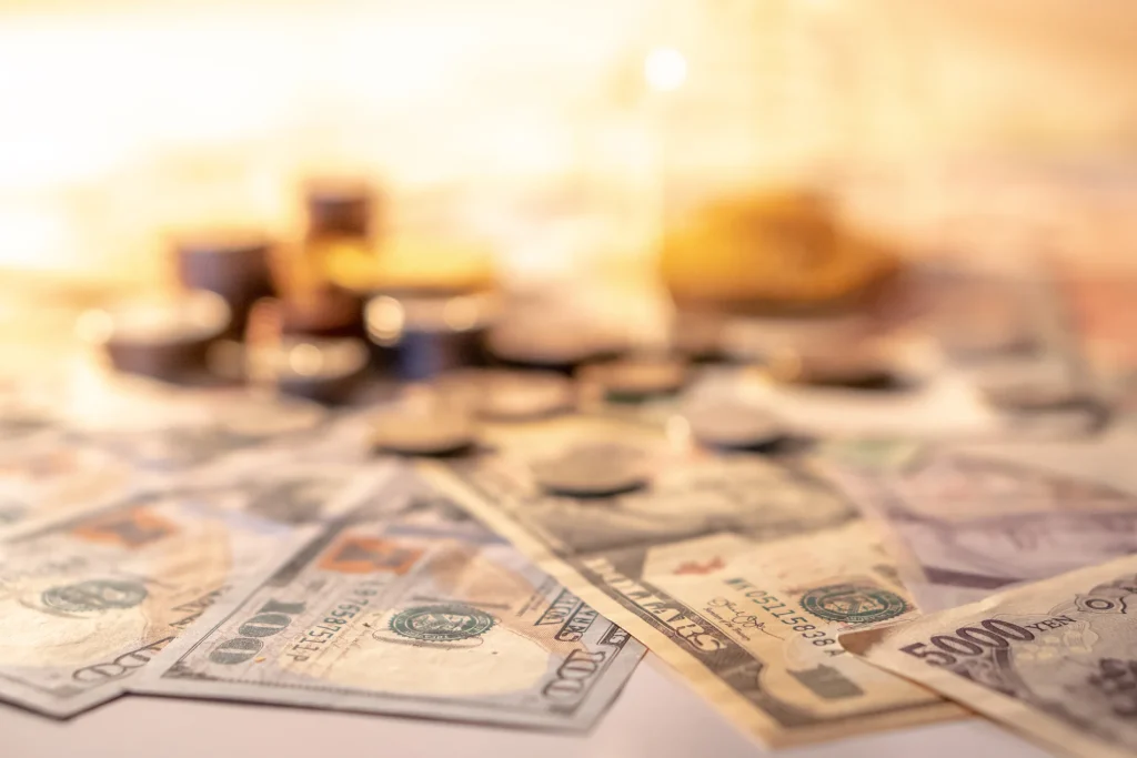 Cash notes and coins spread across a table, how to get your bond back